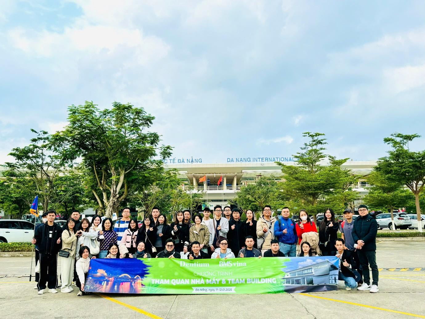 A group of people posing for a photo 
Description automatically generated