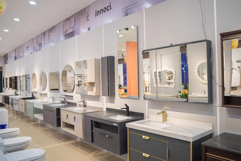 A bathroom sink and mirror in a store
Description automatically generated